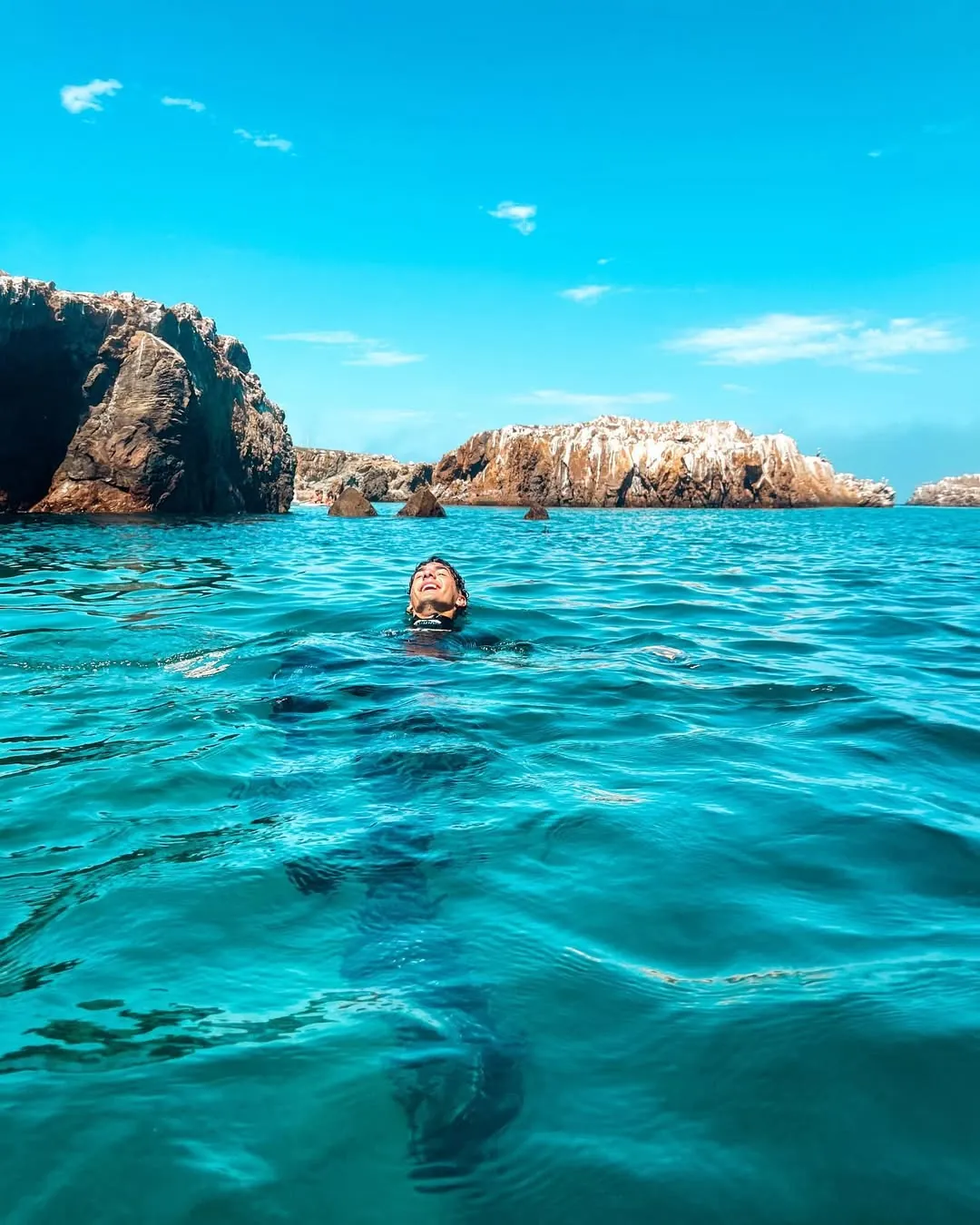 Blossom creator swimming in turquoise water